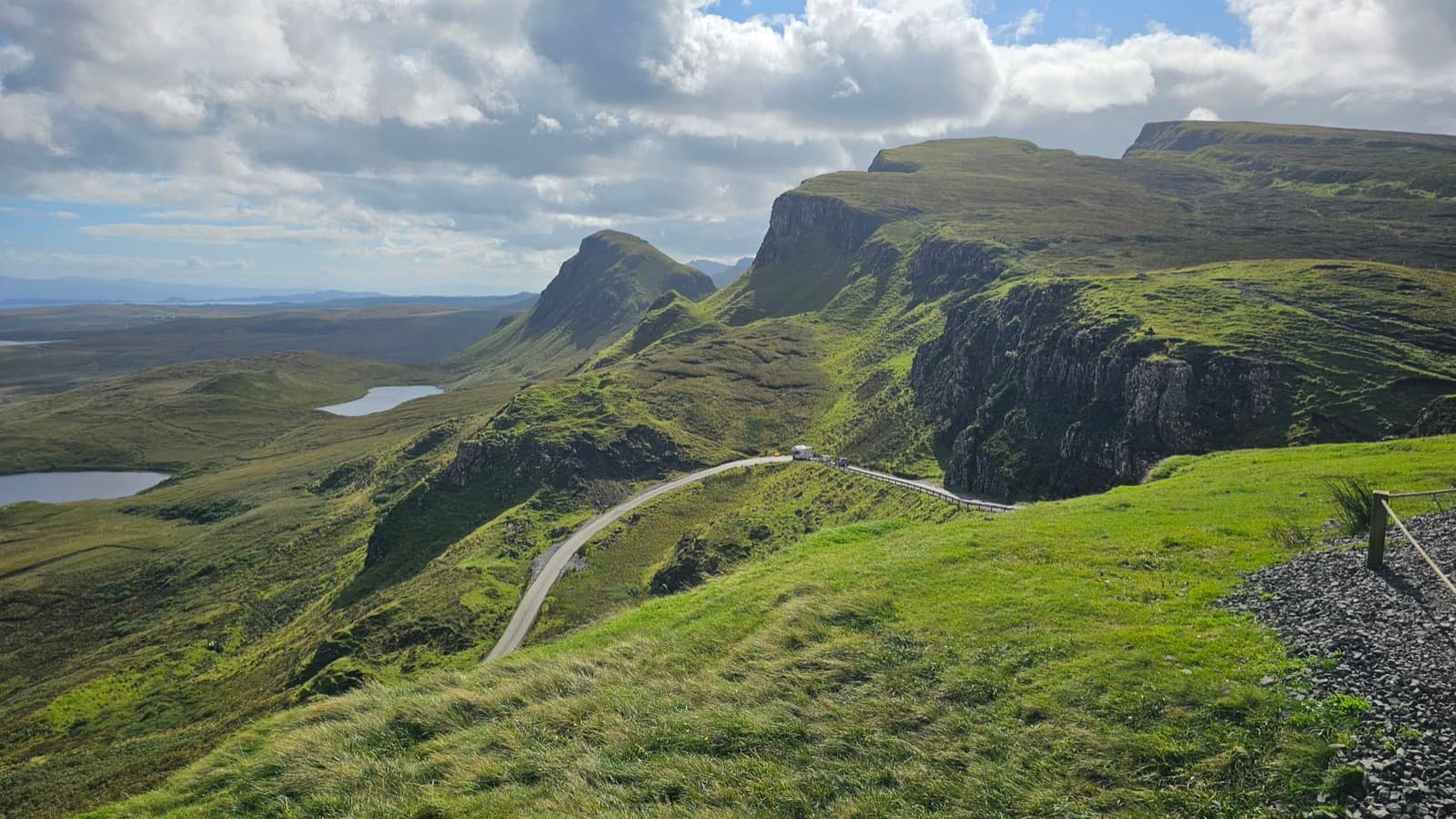 Green hills, cliffs and a winding road at the Quiraing on the Isle of Skye